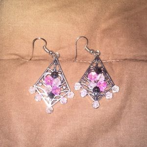 Silver earrings with multi color gems.